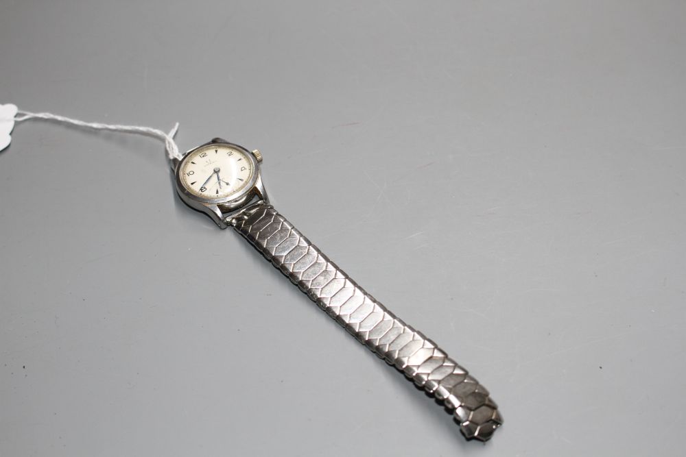 A gentlemans early 1940s stainless steel mid-size Omega manual wind wrist watch, on associated bracelet.